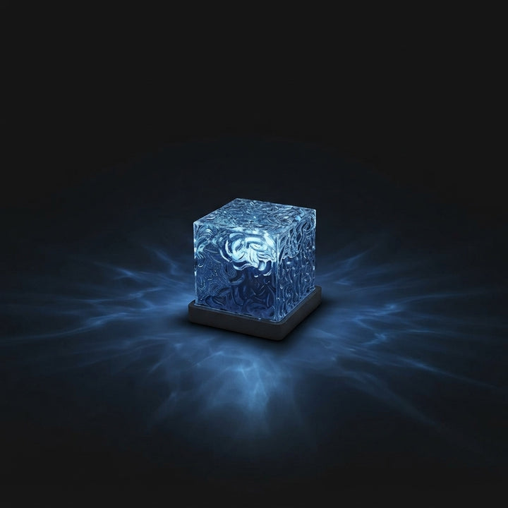 A sleek ocean wave projector lamp emitting soothing deep blue ripple patterns against a dark charcoal background.